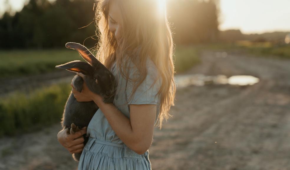 Woman holding a rabbit