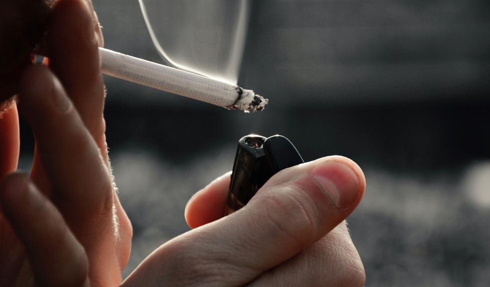 A Close-Up Shot of a Person Smoking a Cigarette