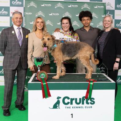 Diesel, winner of Scruffts at Crufts 2024, with owner Claire Whitehead