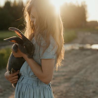 Woman holding a rabbit