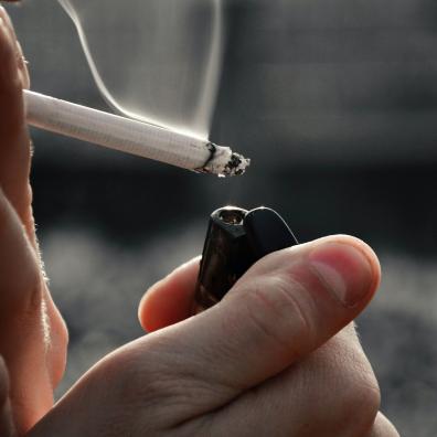 A Close-Up Shot of a Person Smoking a Cigarette